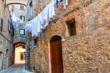 Fototapeta na wymiar Charming little tight narrow streets of Volterra town