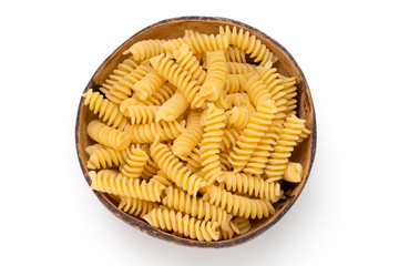 Uncooked fusilli pasta isolated white background.