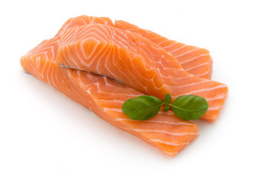 Fresh salmon fillet with basil on the white background.