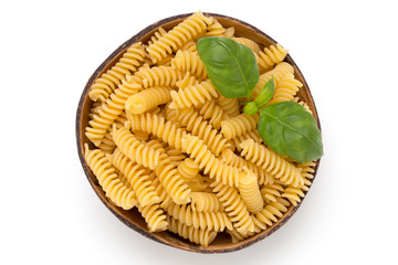 Uncooked fusilli pasta isolated white background.