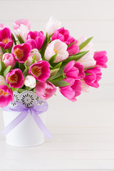 Pink tulip on the white background. Easter background