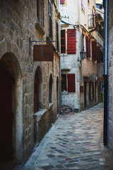 Narrow streets of the ancient city-fortress of the Mediterranean. Travel to Montenegro, Kotor.