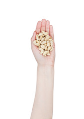 Obraz premium Female hand hold healthy bio cashew nuts