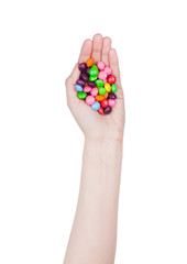 Female hand hold round color chocolate candies