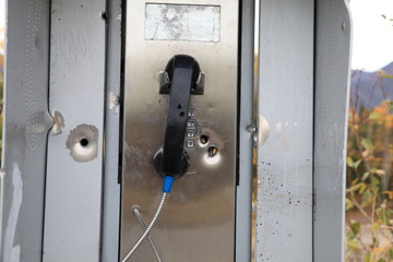 shot phone box with bullet holes Alaska