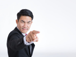 Portrait of a angry businessman pointing finger  isolated on white background.