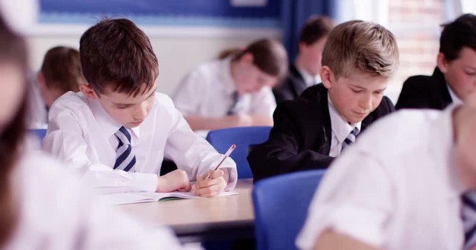4k, Group of students taking  test in a classroom.