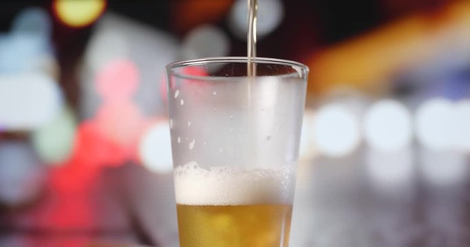 Pouring beer into glass