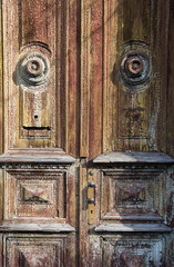 old wooden doors with a cracked paint