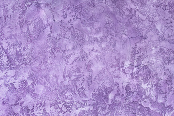 Plaster hue Ultra Violet. Textured background. Wall of the house.