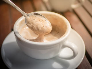 Mocha hot coffee in white cup.