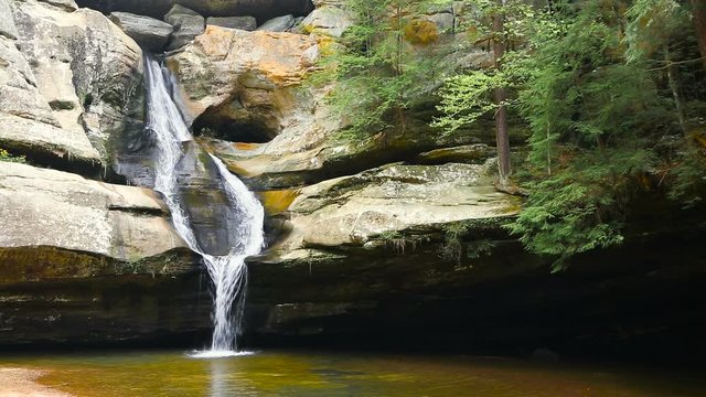 Cedar Falls, a beautiful waterfall in Ohio's Hocking Hills State Park, splits into two streams and then reunites before plunging into the pool below. Seamless loop.