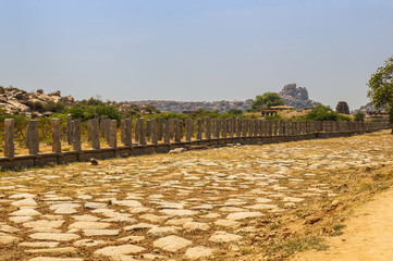 Pillars of old ancient ruined temple. Hampi, Karnataka, India