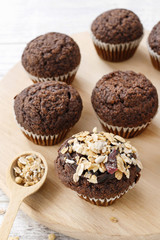 Chocolate muffins with oatmeal flakes.