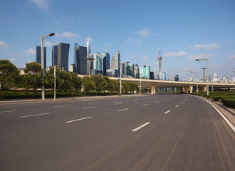 Fototapeta na wymiar Empty road surface floor with city landmark buildings of Shanghai Skyline