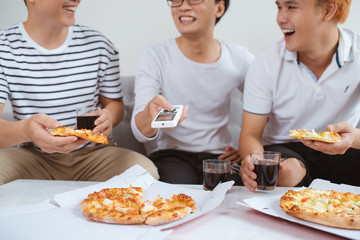 People eat fast food. Friends hands taking slices of pizza