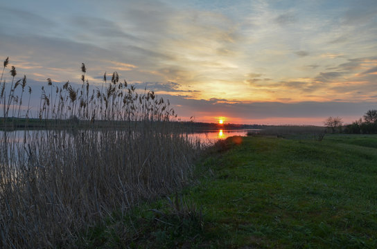 sunrise on green banks of Mechetka river in spring stanitsa Mechetinskaya, Rostov region, Russia