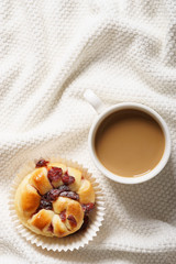 coffee cup and bread in bed, cozy breakfast