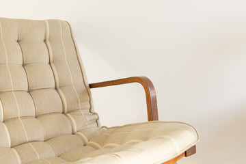 Armchair with Riveted Cushion Backrest on a White Background