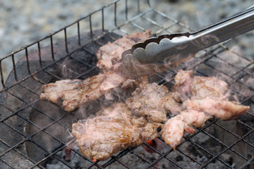 Grill Beef ferment salt on grill which has fire hot in stove style Thailand