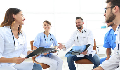 medical staff discussing x-ray of a patient