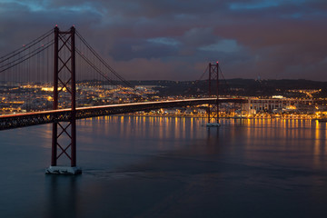 Lisbon (Portugal) - View of river Tejo in the sunset and 25th April Bridge