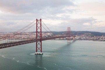 Lisbon (Portugal) - View of river Tejo in the sunset and 25th April Bridge