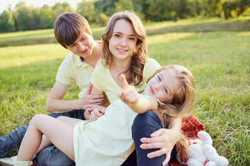 Happy family in the park on a sunny day in the summer.