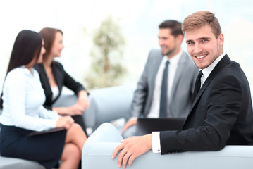 Fototapeta na wymiar successful business man at the office on the background of business team