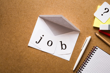 White envelope on the table. Inscription job and sign of question. Looking for a new dream job....