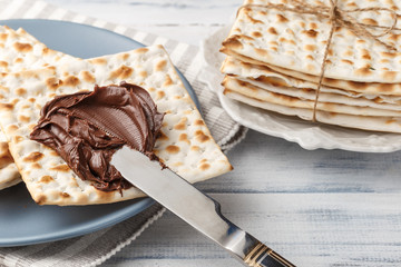 Matzah bread with chocolate cream and knife