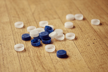 bottle plastic tops on wood