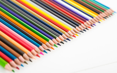 colored pencils lying in row