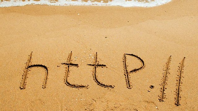 The word http handwritten in sand on a beach