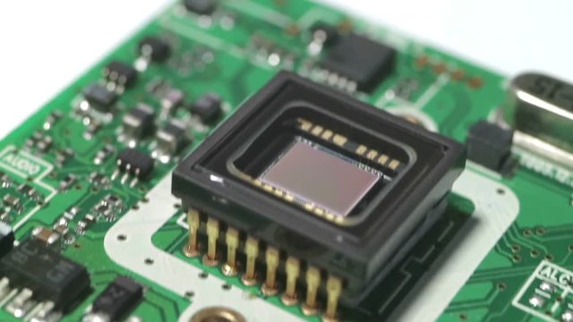 Optical sensor on a square printed circuit board. Extreme increase. Smooth slow motion