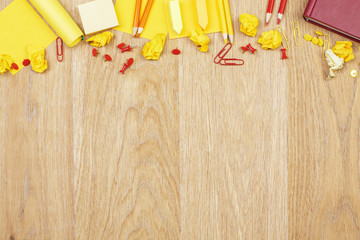 Wooden desk with colorful supplies