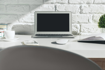 Creative modern desktop with laptop