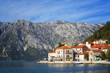 Fototapeta na wymiar Beautiful view of the houses on the waterfront in Perest and the mountains in the background, Montenegro