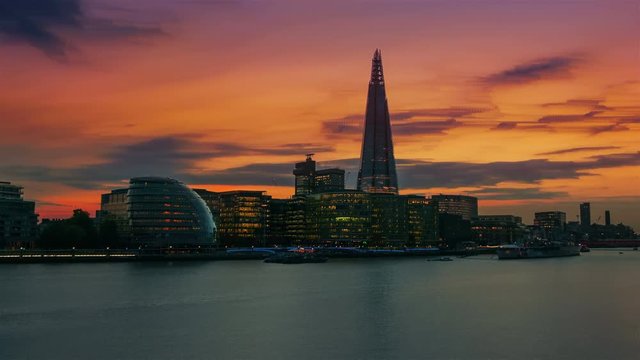 An impressionist evening to night timelapse of the Thames, Shard and the City Hall in London, England, UK