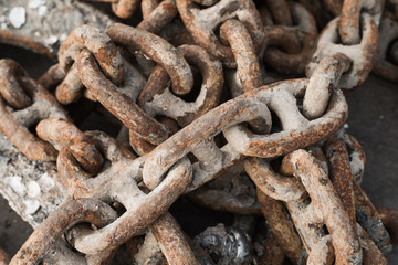 Old rusty chain at sea port; close-up
