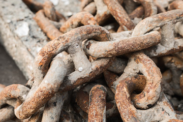 Old rusty chain at sea port; close-up