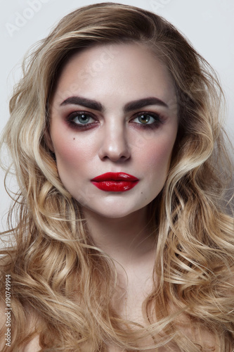 Young Beautiful Woman With Blonde Curly Hair And Red Lipstick