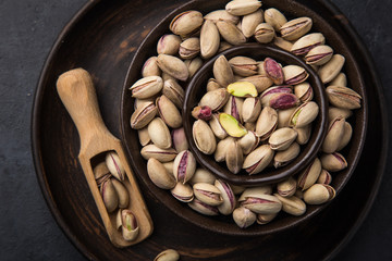 roasted and salted pistachios on brown bowl