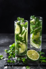 Mojito cocktail with  lime and mint on black background
