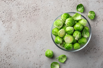 fresh raw brussel sprouts in glass bowl.