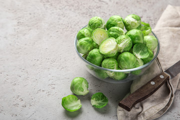fresh raw brussel sprouts in glass bowl.