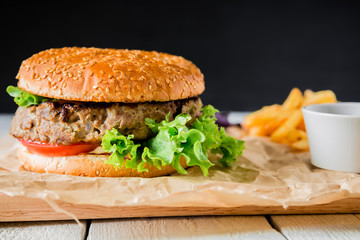 Classic burger on dark background. American fast food