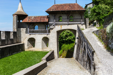Fototapeta na wymiar Gruyeres, Switzerland - June 10, 2016: Idyllic Medieval the small Castle Swiss Village Gruyeres, Switzerland