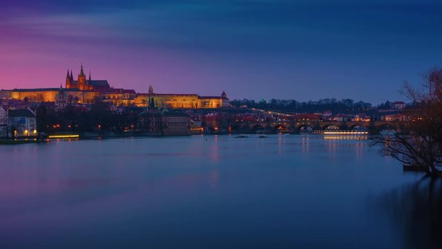 Cinemagraph-like  timelapse of the Vltava river and Charles Bridge from dusk to night in Prague, Czech Republic, Czechia