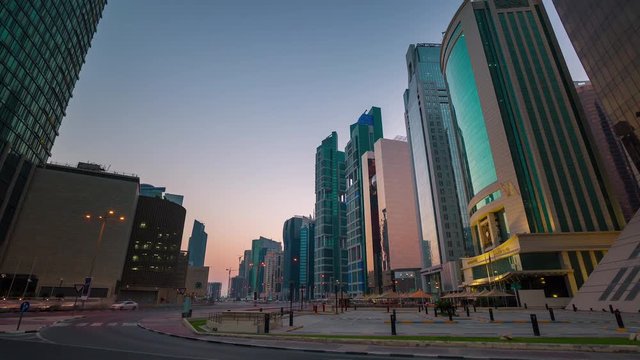 Doha Qatar skyline skycreapers tall buildings timelapse sunset near Persian gulf , Middle East